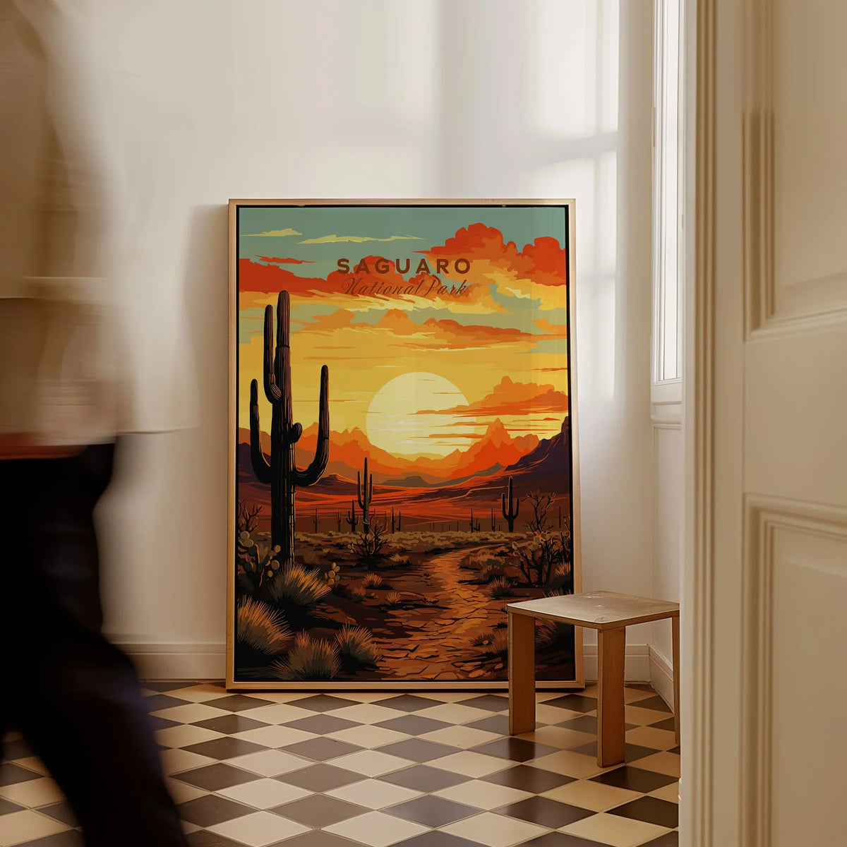 Framed Saguaro National Park travel poster with vivid desert sunset on checkered floor.