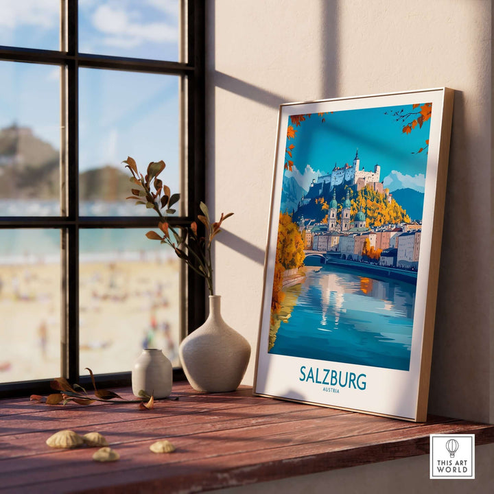 Salzburg travel poster showcasing the city's landmarks, framed and displayed near a window with natural light.