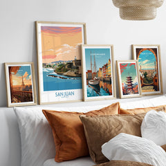 Framed travel posters of Paris, San Juan, Copenhagen, Tokyo, and Barcelona for wall art decor