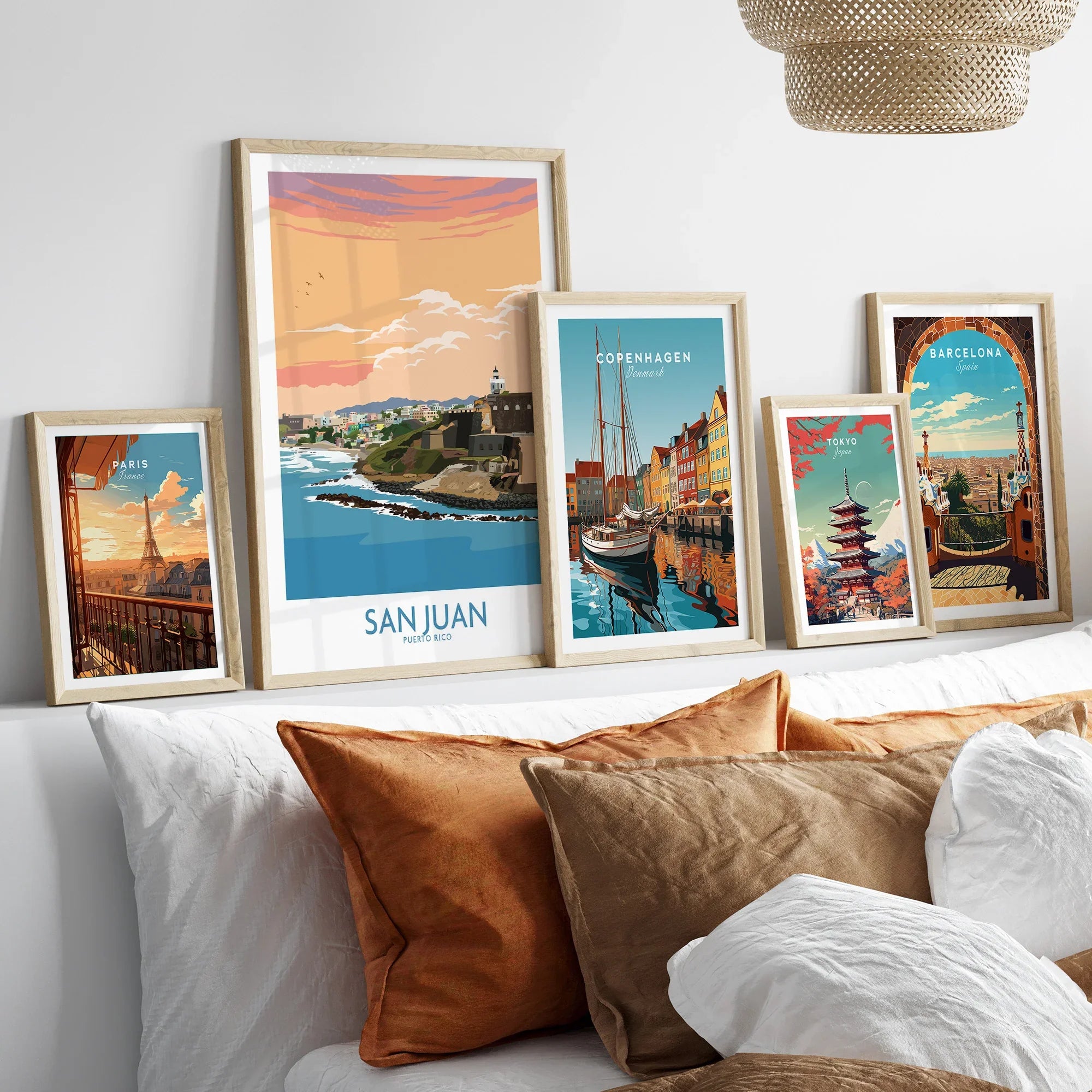 Framed travel posters of Paris, San Juan, Copenhagen, Tokyo, and Barcelona for wall art decor