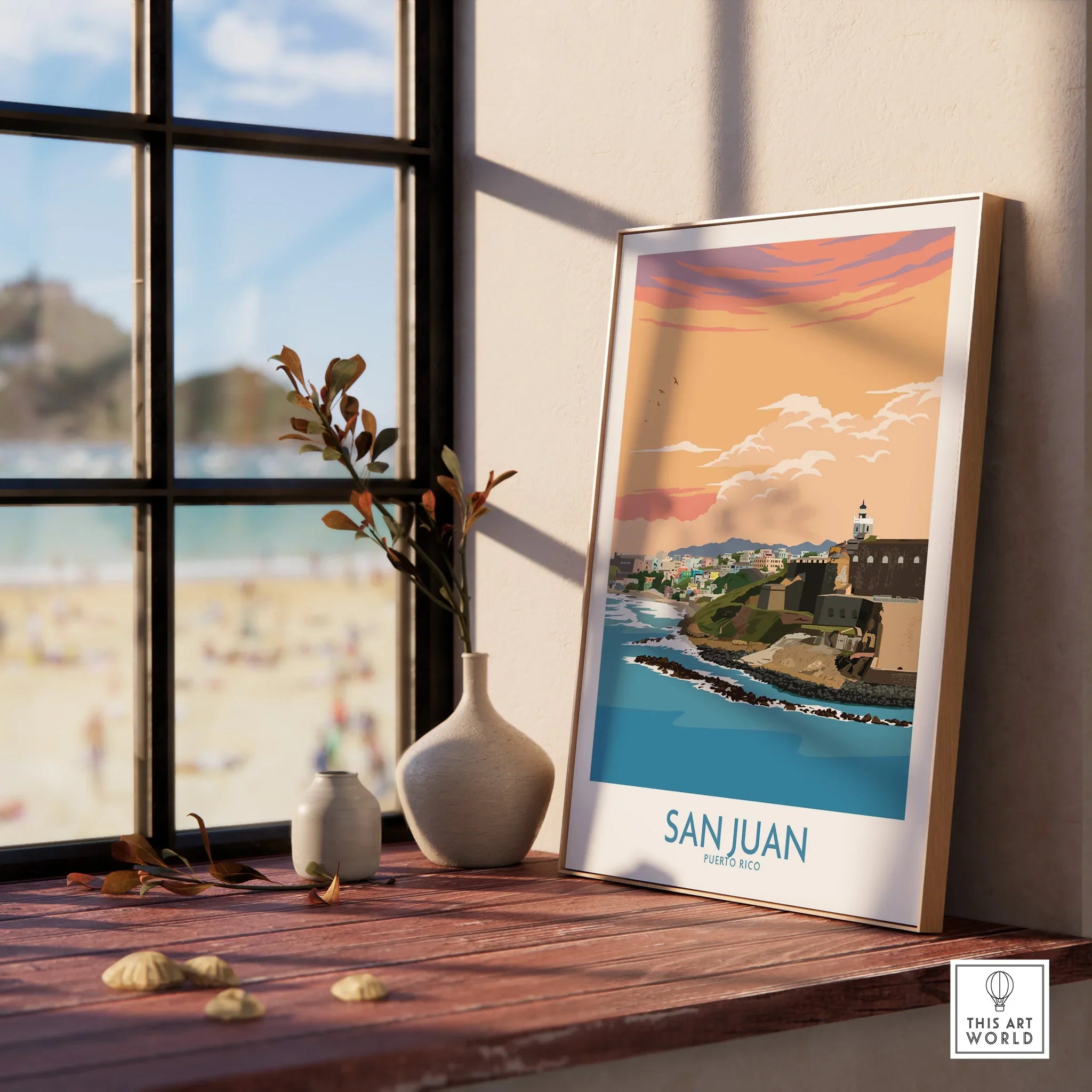 San Juan Puerto Rico travel poster with coastal cityscape, sunset sky, and lighthouse, displayed on windowsill.