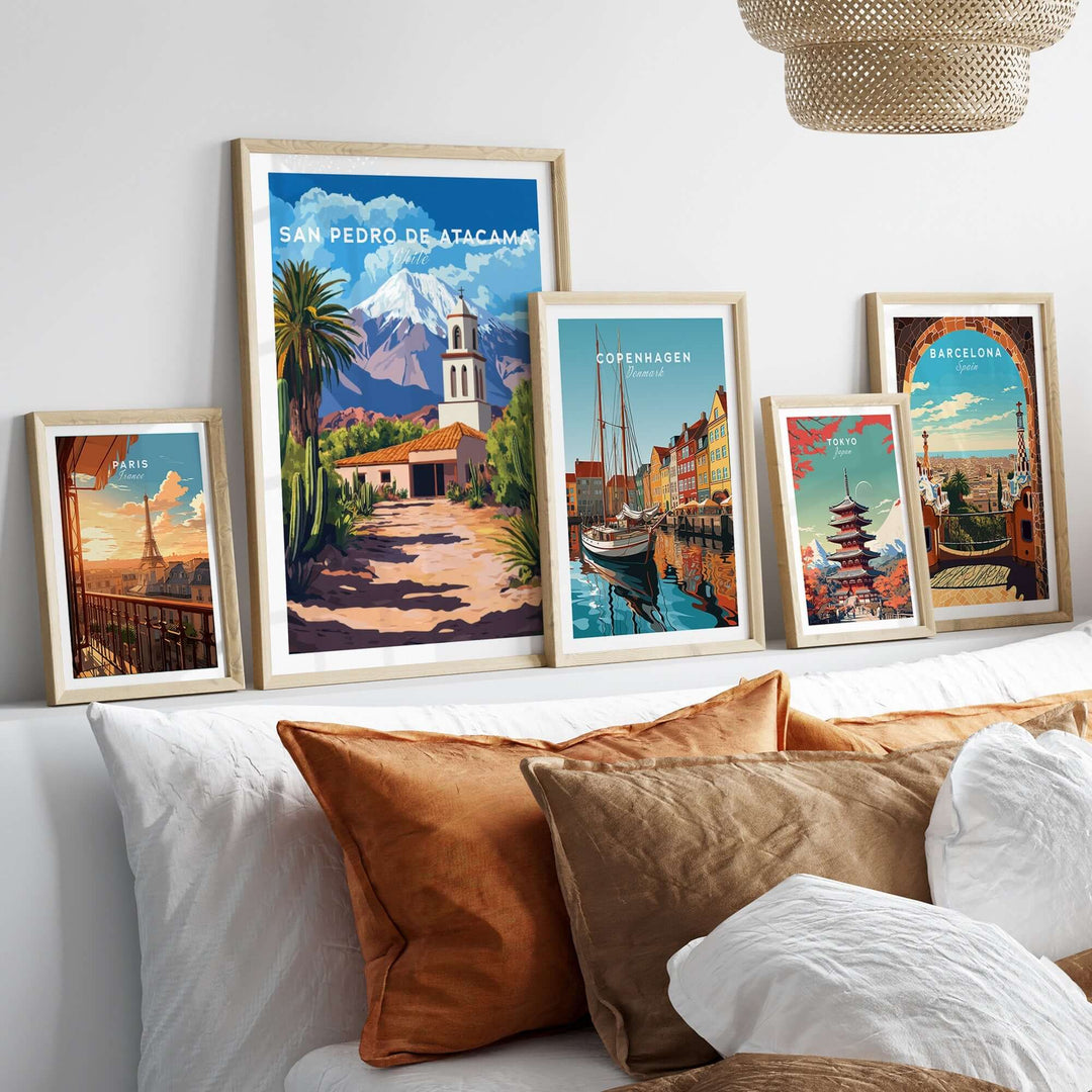 San Pedro de Atacama Chile poster displayed among other travel posters on a stylish bed with decorative pillows.