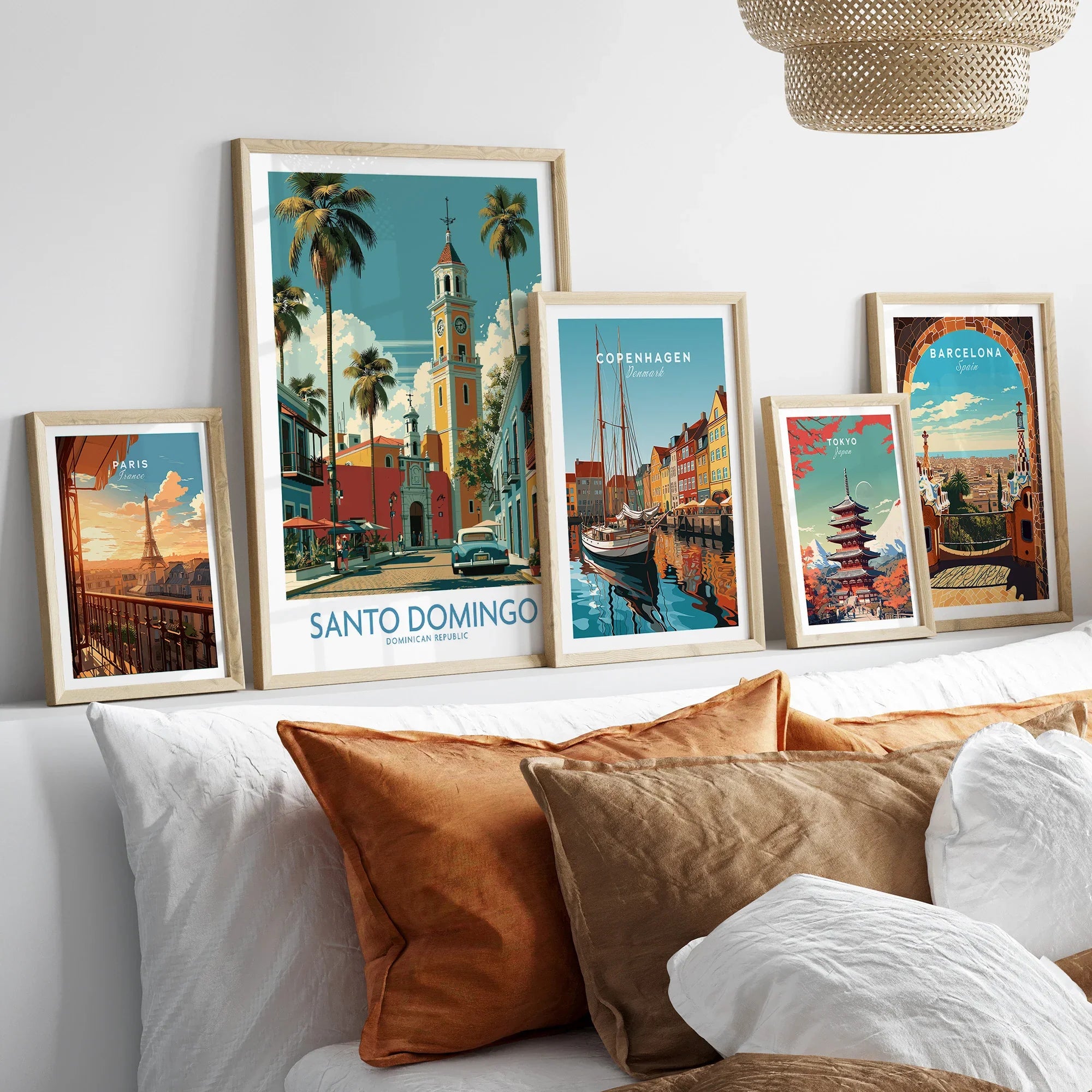 Framed travel posters of Paris, Santo Domingo, Copenhagen, Tokyo, and Barcelona for wall art decor
