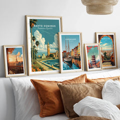 Framed travel posters of Paris, Santo Domingo, Copenhagen, Tokyo, and Barcelona for wall art decor
