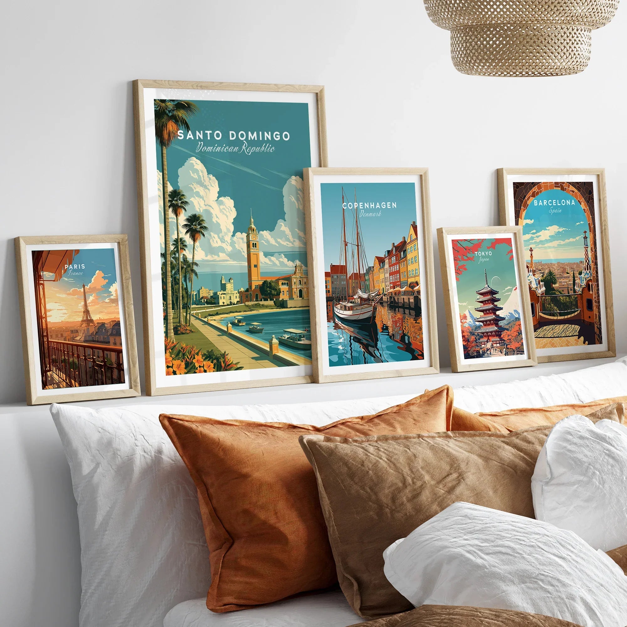 Framed travel posters of Paris, Santo Domingo, Copenhagen, Tokyo, and Barcelona for wall art decor