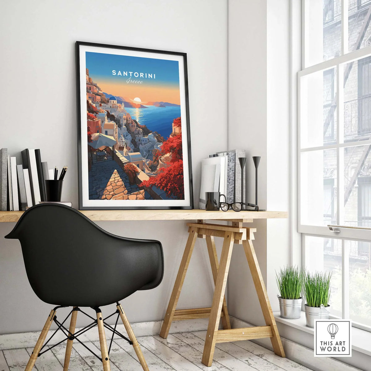 Santorini Poster framed and displayed in a modern home office setting with a stylish chair and desk.
