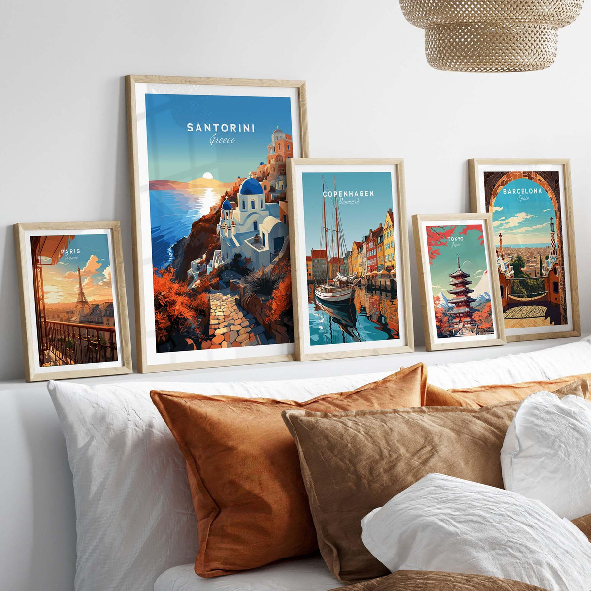Santorini Print featuring framed artwork of Santorini and other travel destinations on a stylish wall.