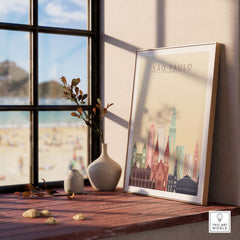 Sao Paulo city skyline poster framed on a wooden table with beach view, vibrant wall art for home decor.