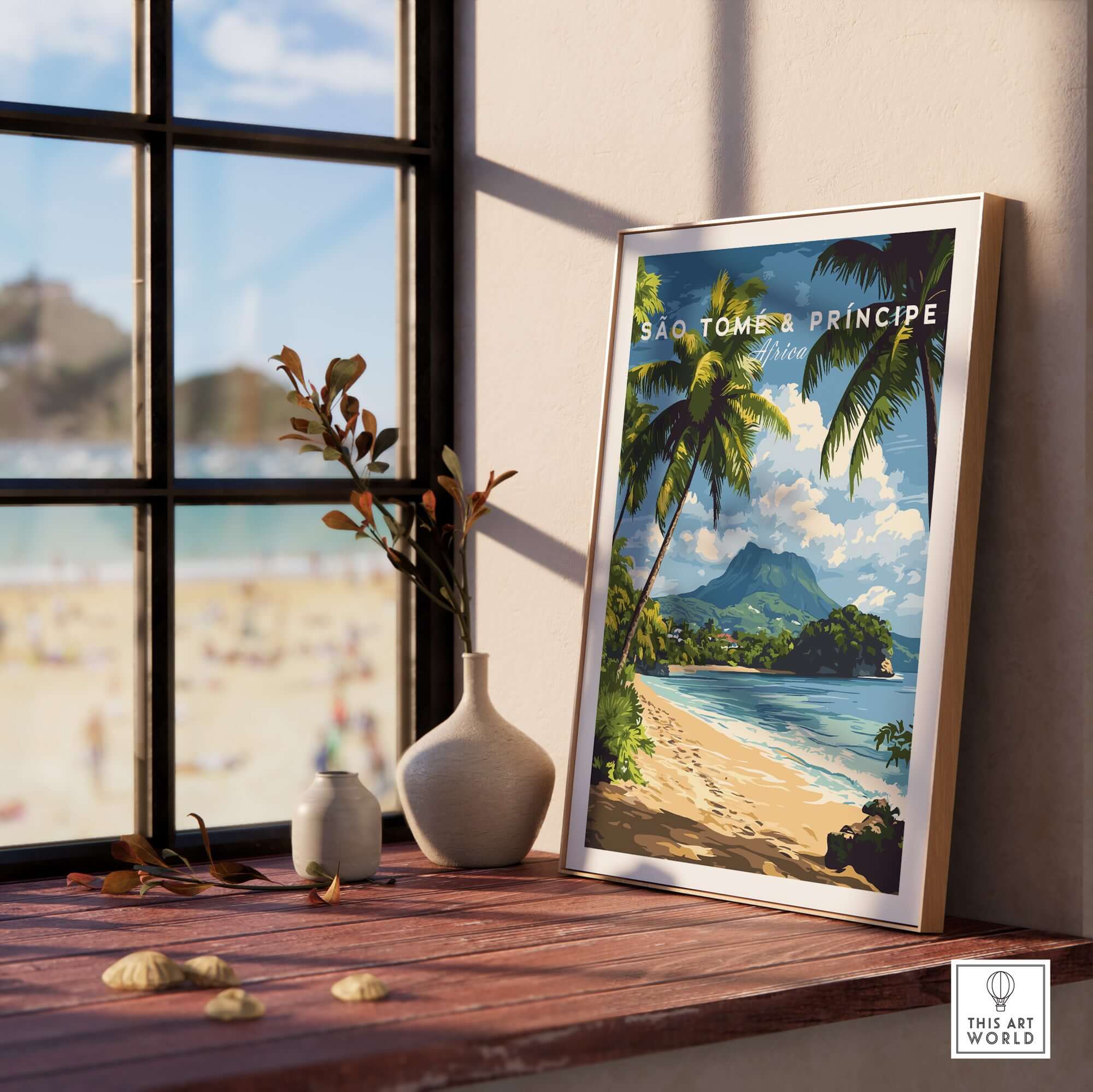 São Tomé & Príncipe: Coastal Paradise Travel Print displayed in a sunlit room by the beach.