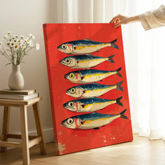 Vibrant red canvas art featuring six illustrated fish, perfect for coastal or modern home wall decor.