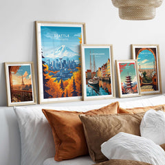 Seattle Skyline Wall Art - Space Needle Travel Poster displayed among other city travel posters on a stylish bed.