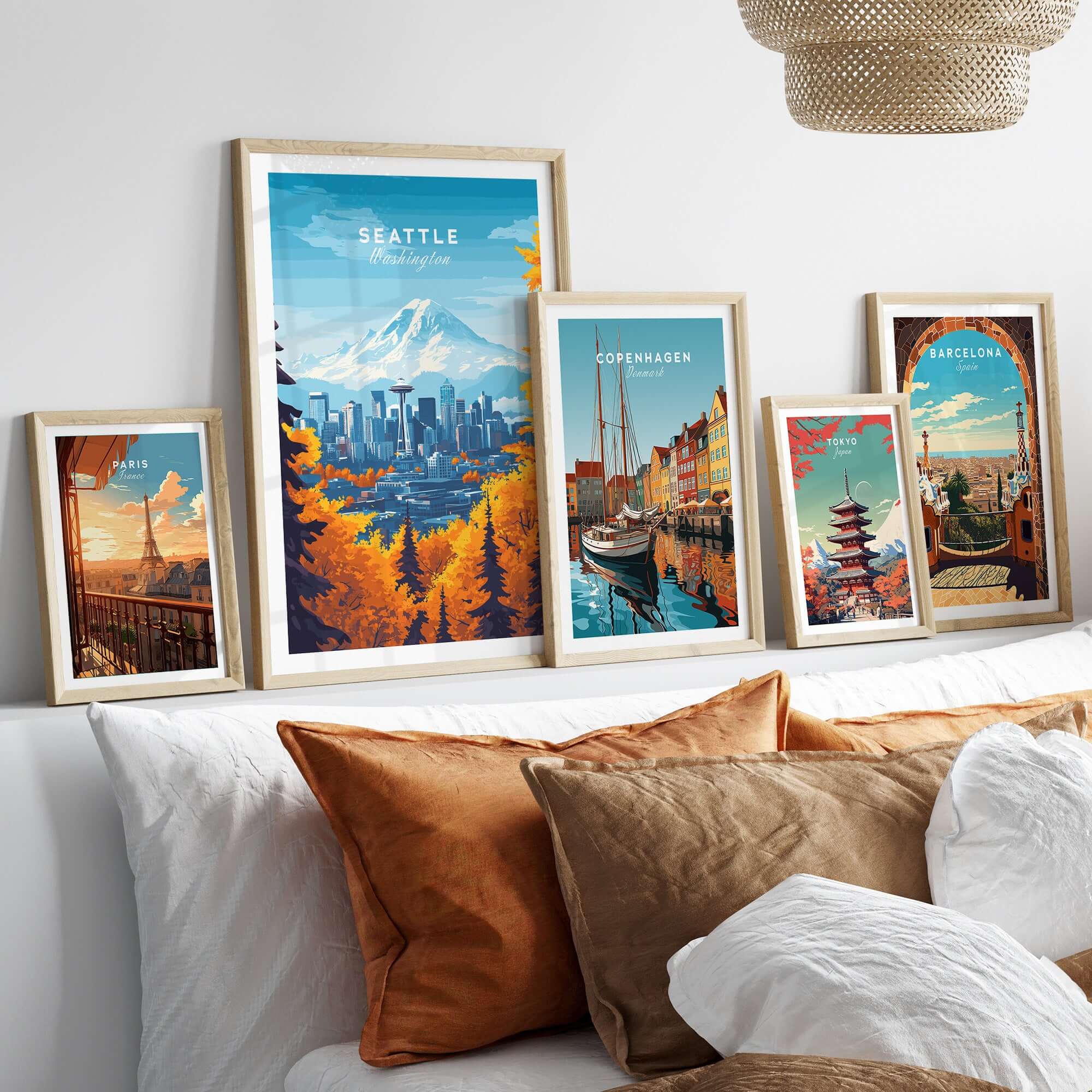Seattle Skyline Wall Art - Space Needle Travel Poster displayed among other city travel posters on a stylish bed.