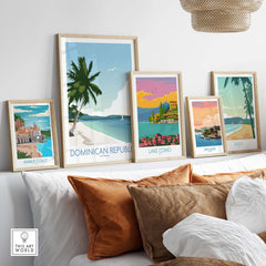 Colorful Dominican Republic wall art prints displayed on a shelf, featuring tropical landscapes in a stylish home decor setting.