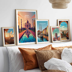 Framed Taj Mahal wall art alongside travel prints of Copenhagen and Barcelona, enhancing home decor with vibrant colors.