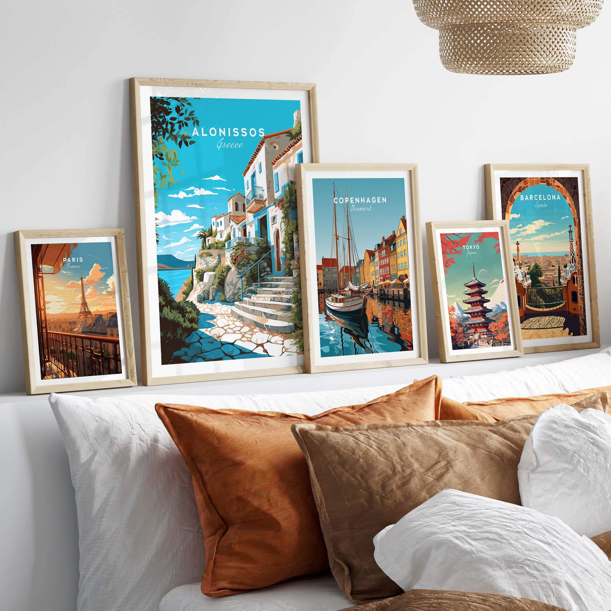 Alonissos Greece travel poster print displayed on a wall with various city-themed art prints and cozy decor.