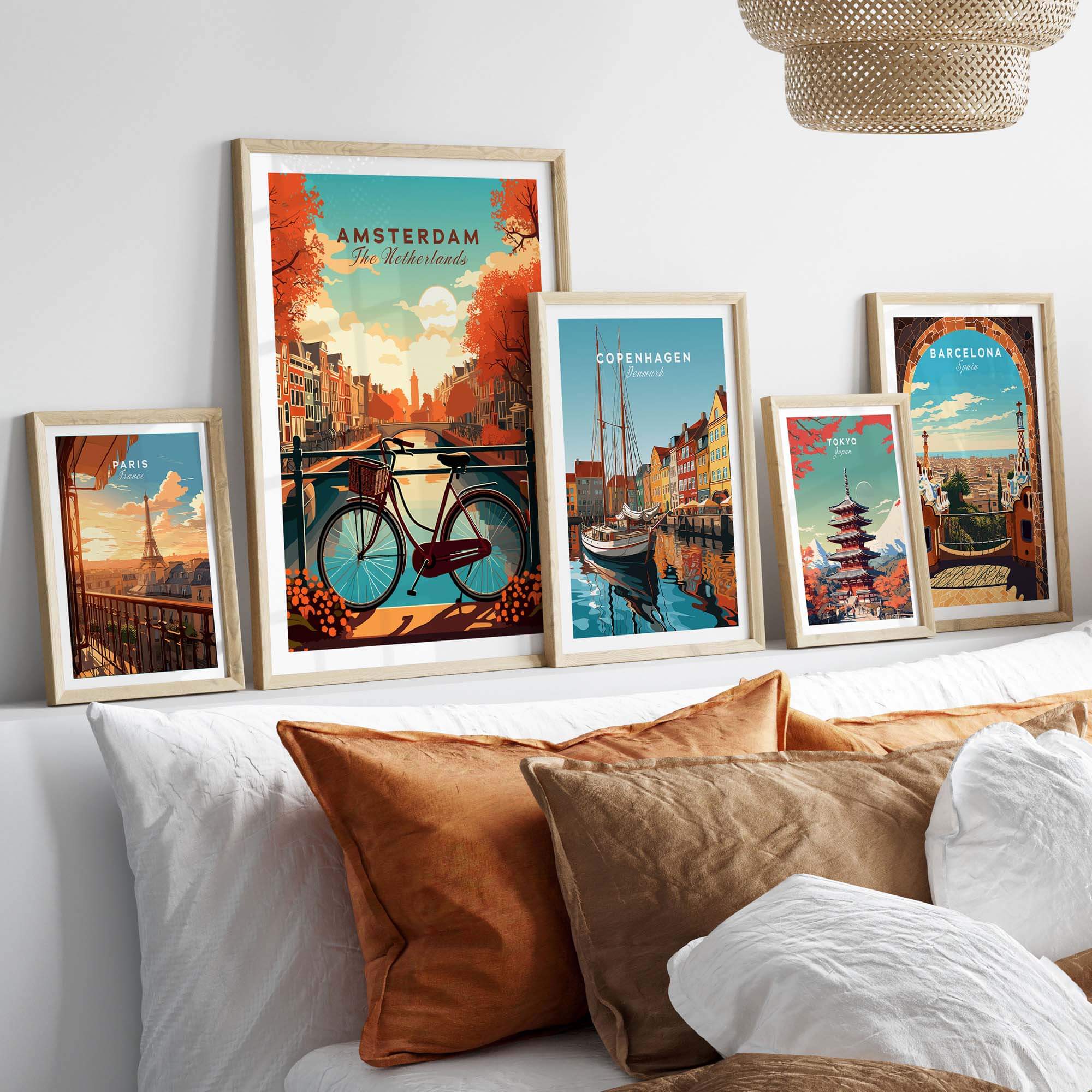 Vibrant Amsterdam art print featuring canals and bikes, displayed with travel prints from Copenhagen and Barcelona.