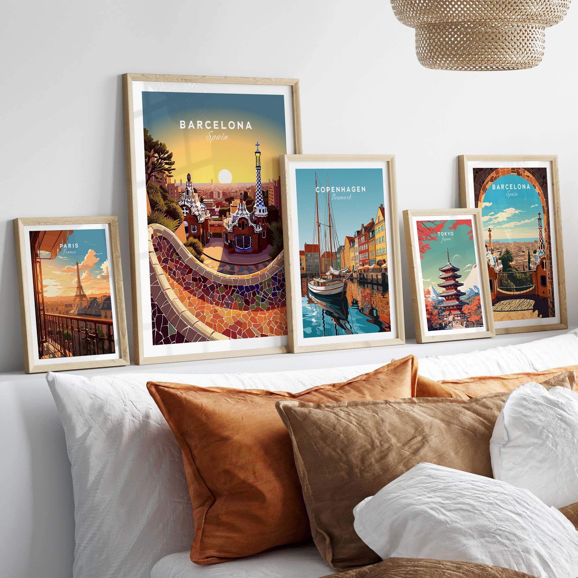 Barcelona travel poster print displayed in a cozy living room setting with decorative cushions and framed art.