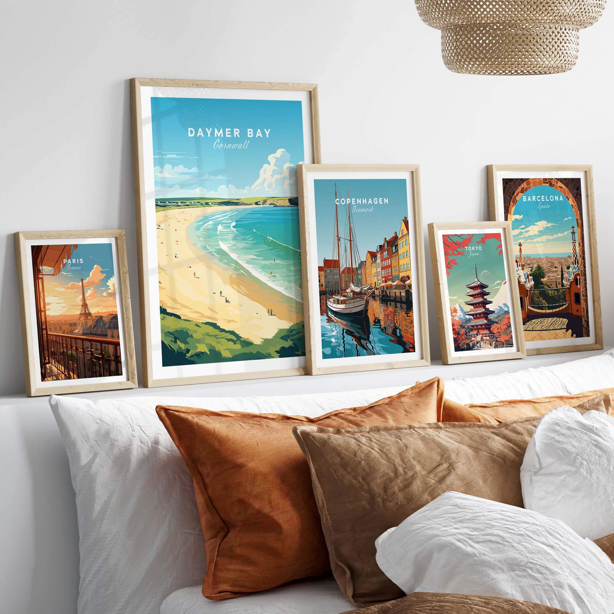 Daymer Bay Cornwall print with travel-themed wall art displayed in a cozy living room setting.