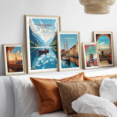 Fjords Wall Art Norway featuring vibrant landscapes and nautical scenes, elegantly displayed above cozy pillows.
