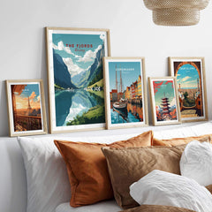 Norway Fjords travel poster displayed alongside art from Copenhagen and Barcelona, enhancing home decor with vibrant scenery.