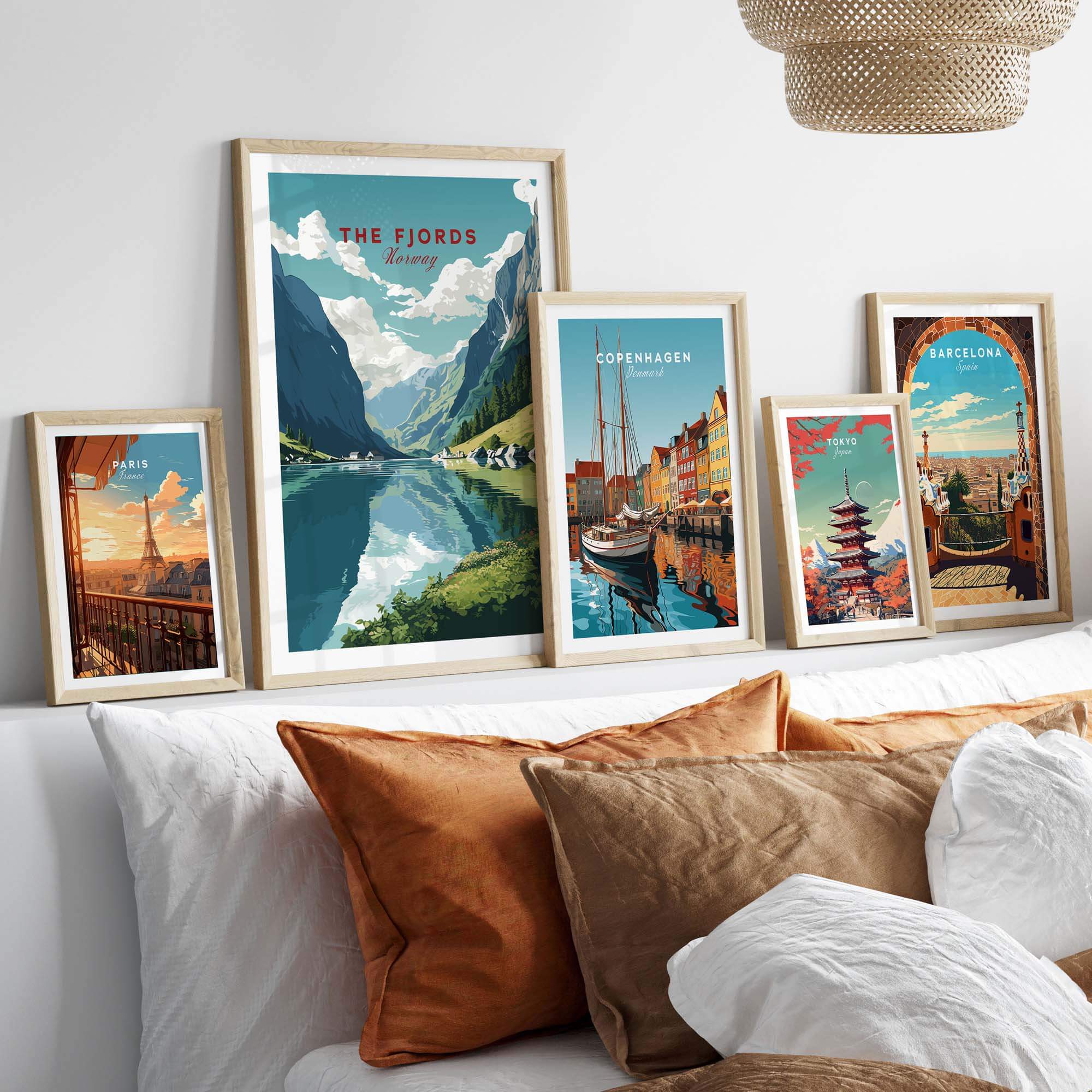 Norway Fjords travel poster displayed alongside art from Copenhagen and Barcelona, enhancing home decor with vibrant scenery.