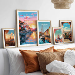 Skopelos Greece travel poster print displayed with other framed art prints in a stylish interior setting.