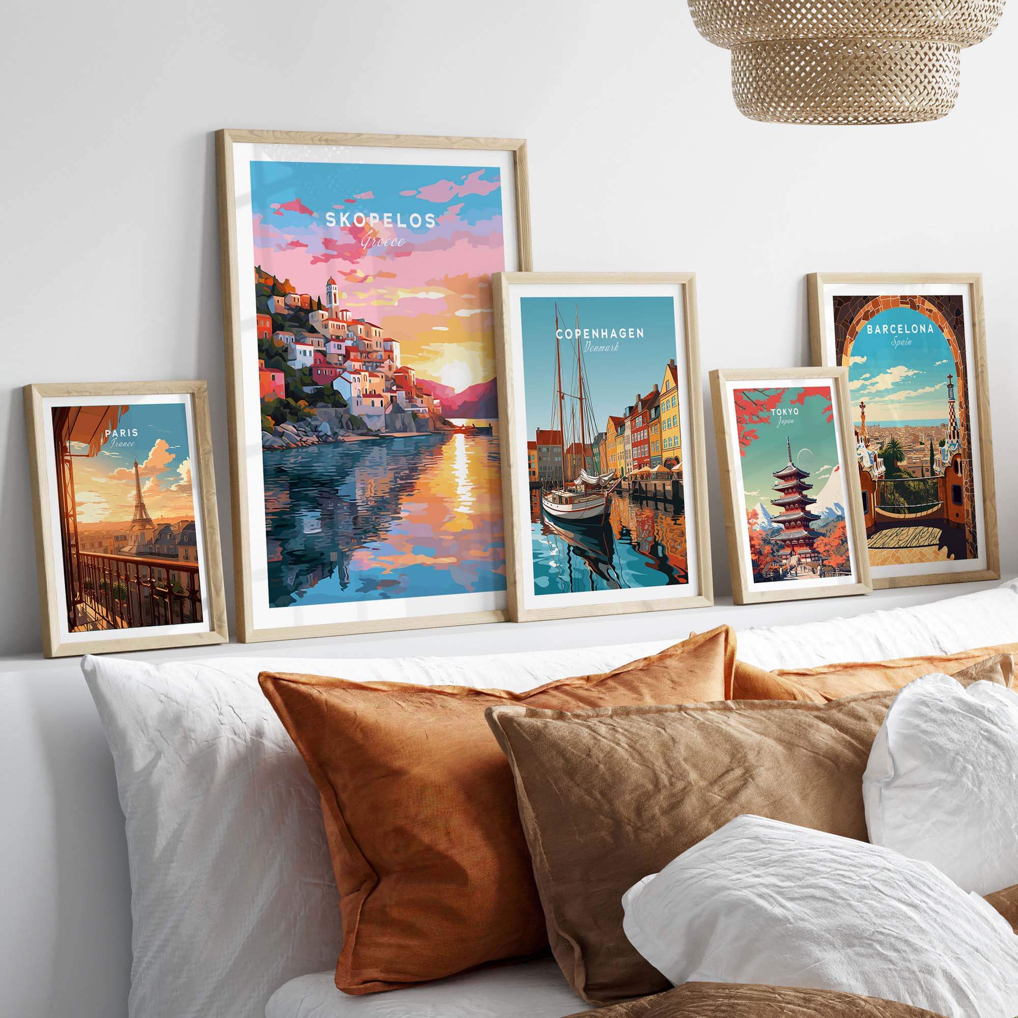 Skopelos Greece travel poster print displayed with other framed art prints in a stylish interior setting.