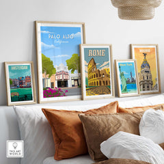 Collection of travel poster prints including Palo Alto, Rome, Madrid, Amsterdam, and New York displayed on a stylish wall.