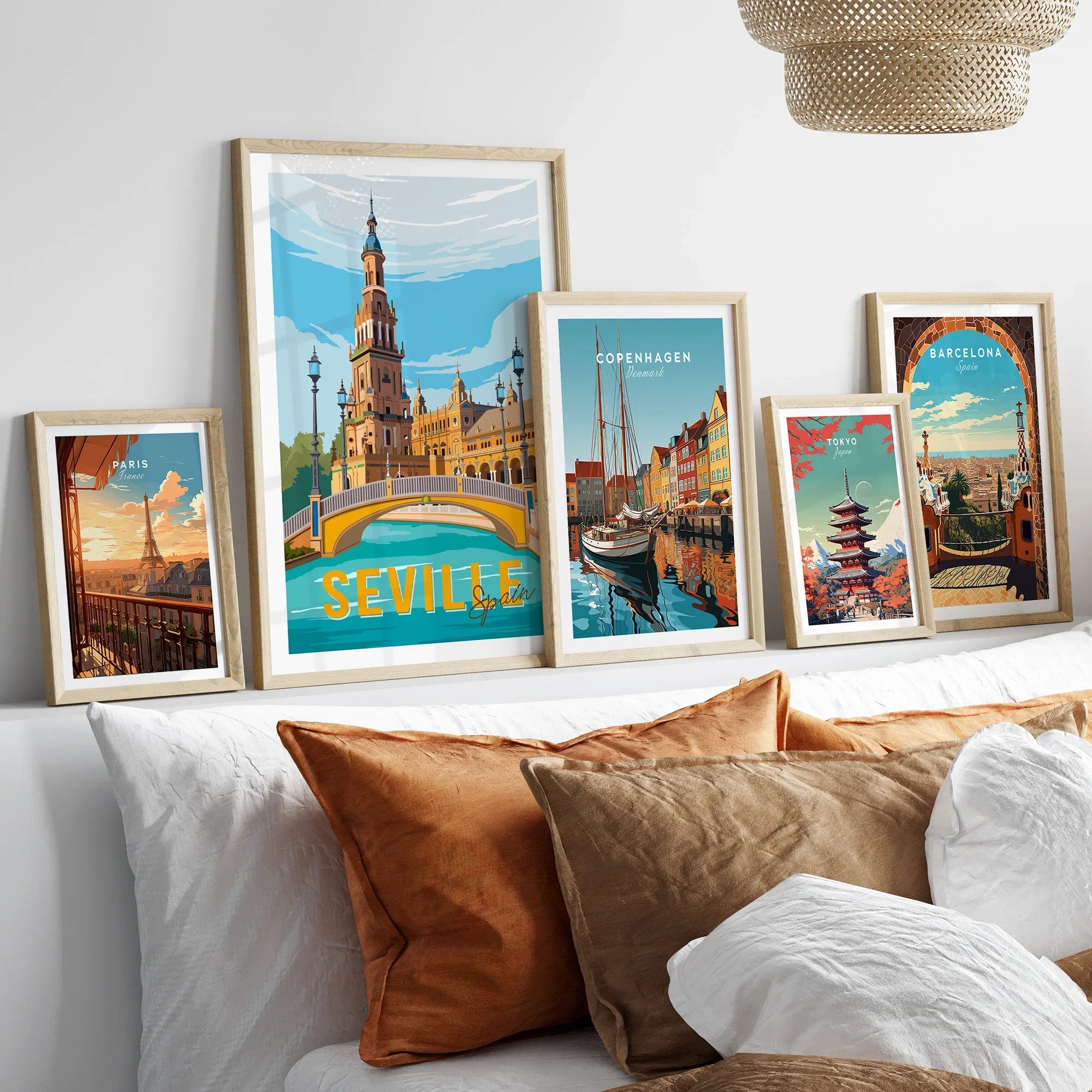 Framed travel posters of Paris, Seville, Copenhagen, Tokyo, and Barcelona for home wall art decor