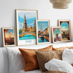 Framed travel posters of Paris, Seville, Copenhagen, Tokyo, and Barcelona for wall art decor