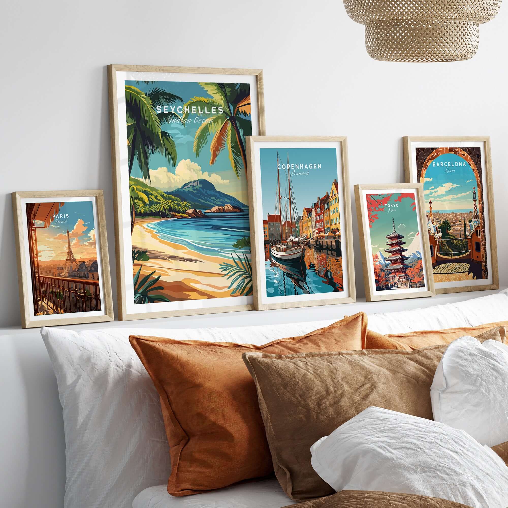 Seychelles Serenity: Stunning Beach Print Decor displayed in elegant frames on a stylish couch.