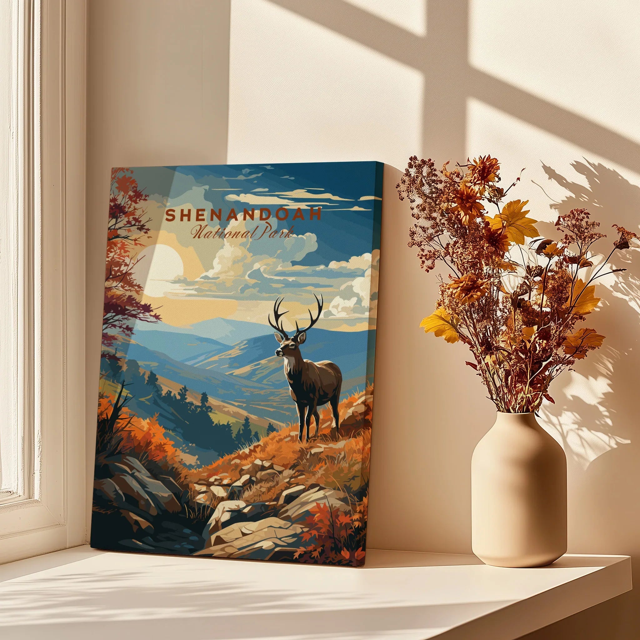 Shenandoah National Park art print with a stag in autumn colors, displayed on a windowsill next to a vase of dried flowers.