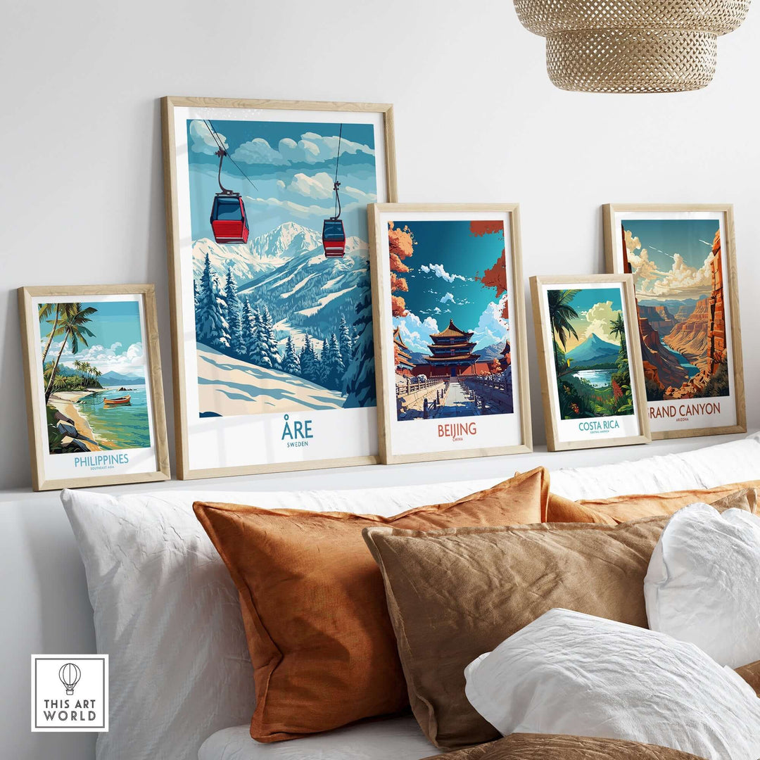 Collection of travel posters featuring Åre, Beijing, Costa Rica, and the Grand Canyon displayed in a cozy living room setting.