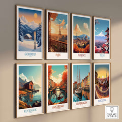 Colorful travel posters on a wall featuring Goderdzi, Paris, Florence, Tokyo, Reykjavik, Amsterdam, Copenhagen, and Barcelona.