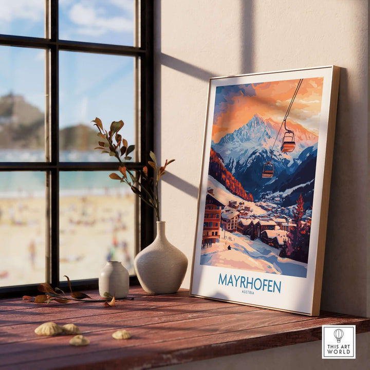 Ski poster of Mayrhofen, Austria, featuring alpine scenery with a ski lift at sunset, displayed in a cozy interior.