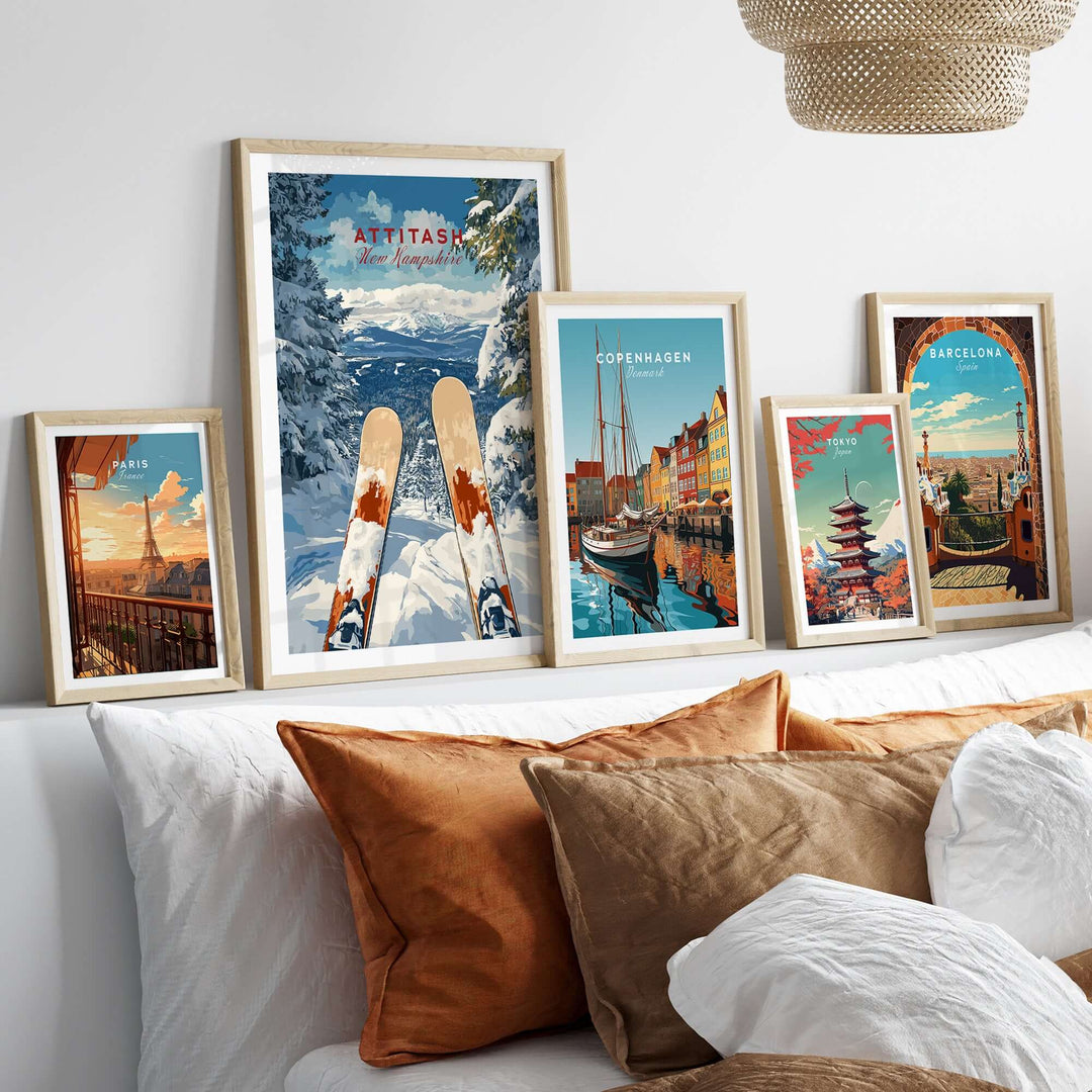 Ski print of Attitash, New Hampshire, framed among other travel artwork on a cozy couch display.