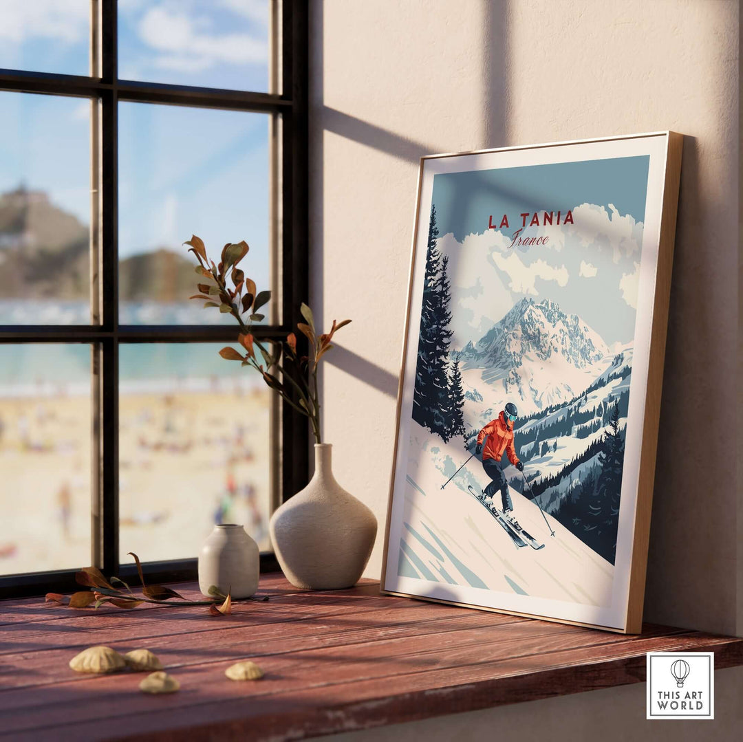 Ski print of La Tania, France displayed in a stylish interior with mountain scenery and skier, inspiring winter adventures.