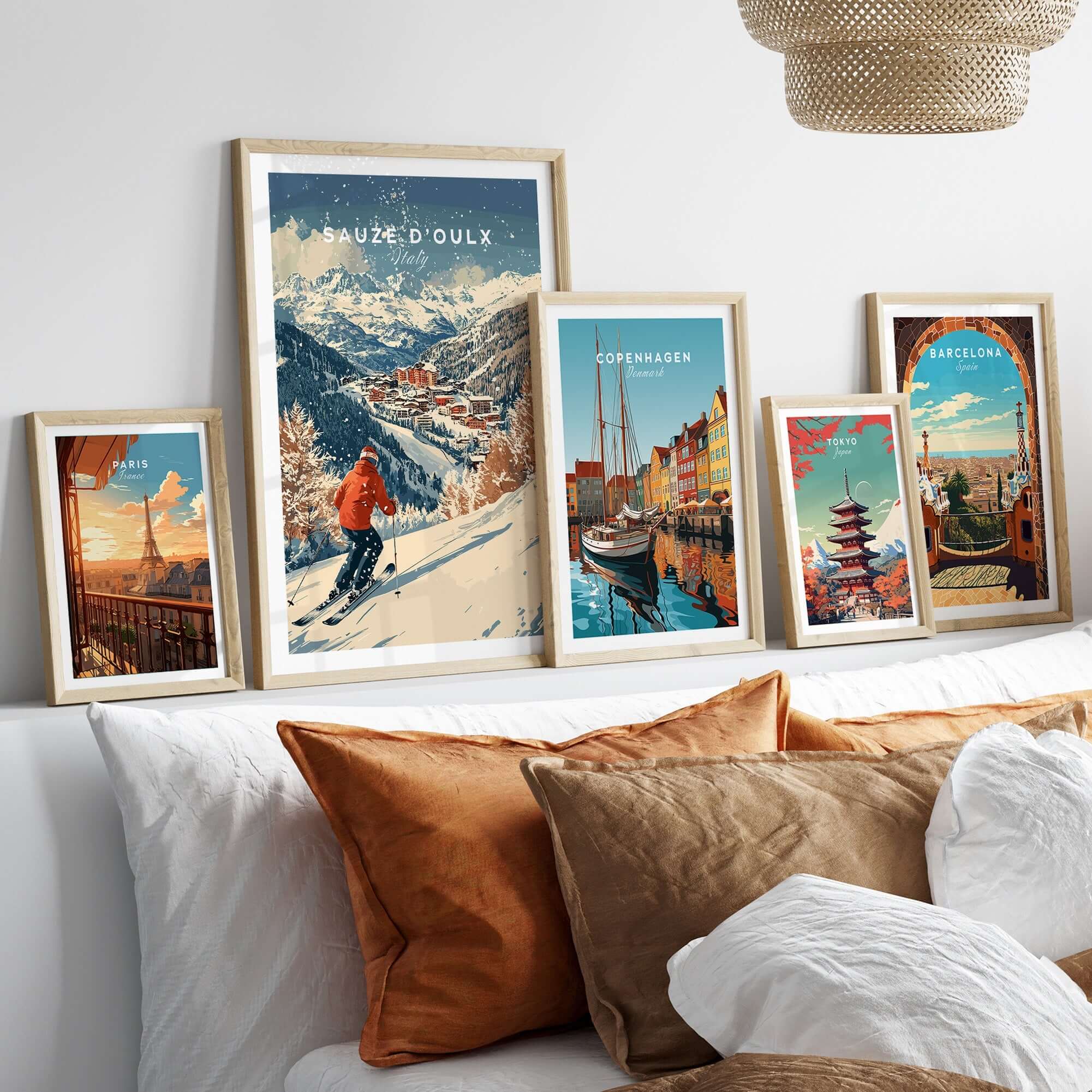 Ski print of Sauze d'Oulx, Italy, displayed among travel art prints on a cozy couch setting.