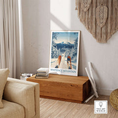 Ski Whiteface poster on wooden table, showcasing skis and winter landscape in cozy interior setting.