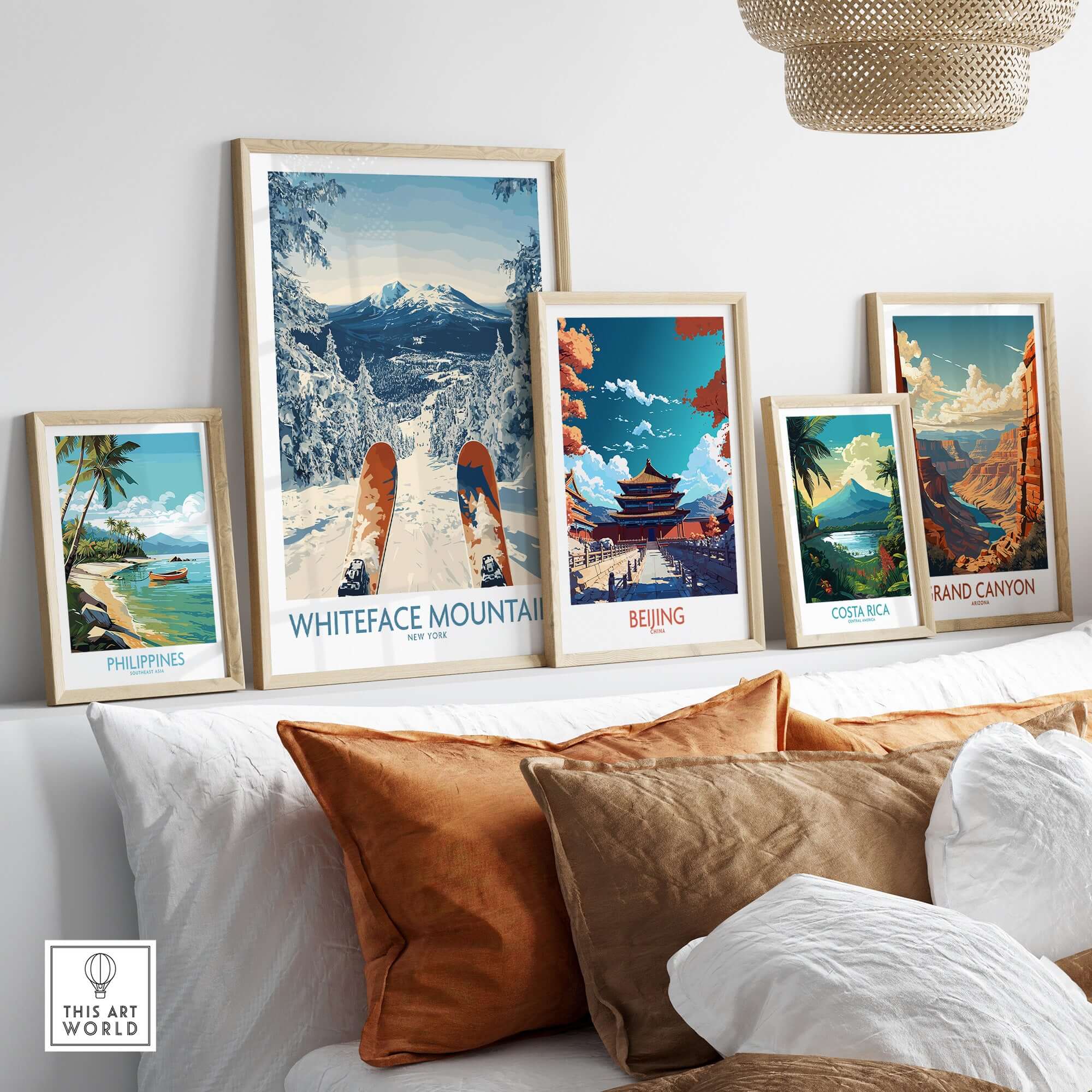 Wall art featuring travel posters of Whiteface Mountain, Beijing, Costa Rica, and the Grand Canyon in a modern living space.