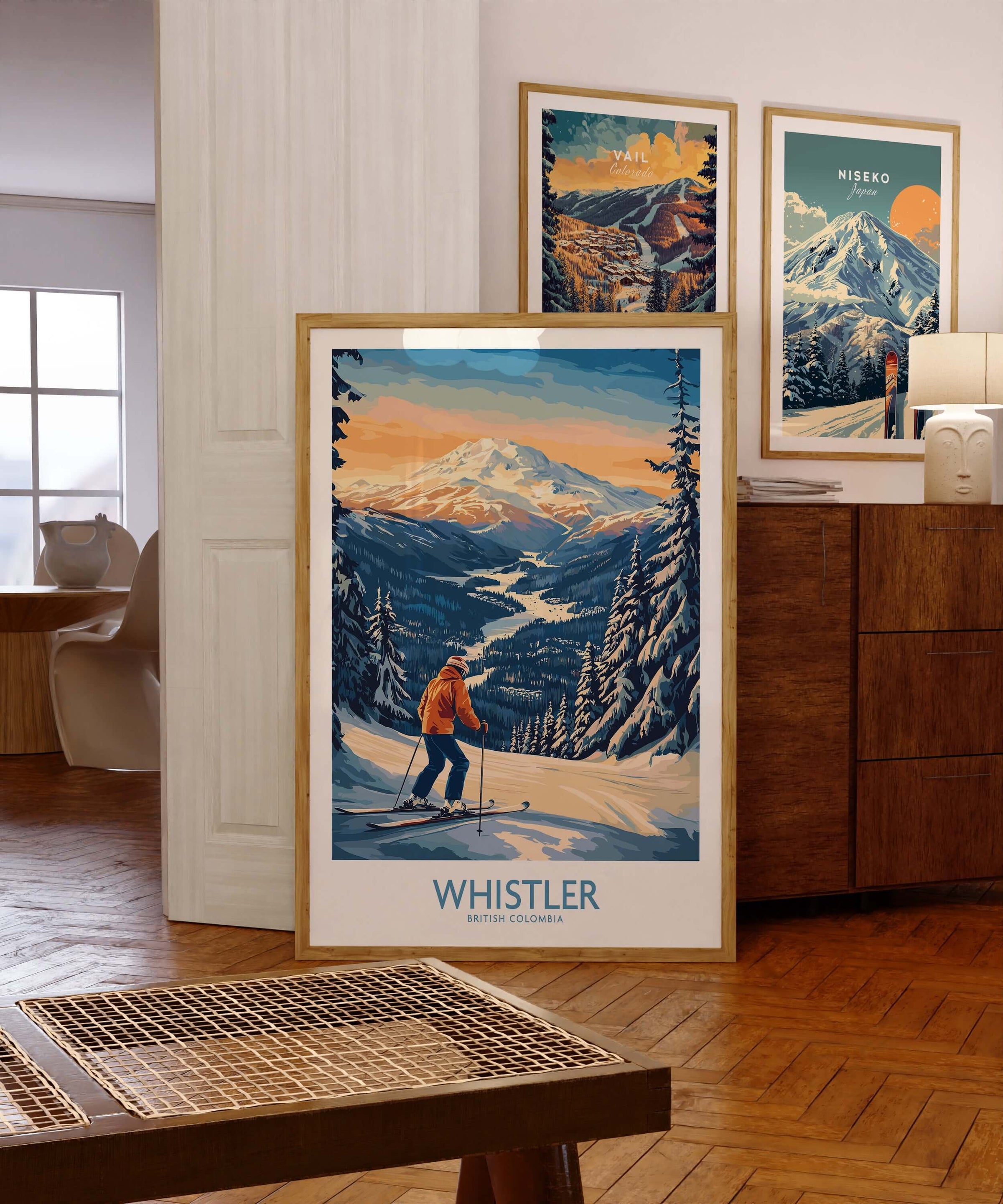 Whistler ski poster displayed in stylish room with vintage mountain art on walls.