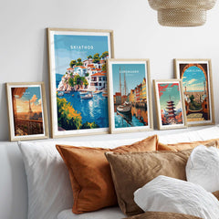 Skiathos Beach Escape: Stunning Greece Poster displayed among other travel posters on a cozy sofa.