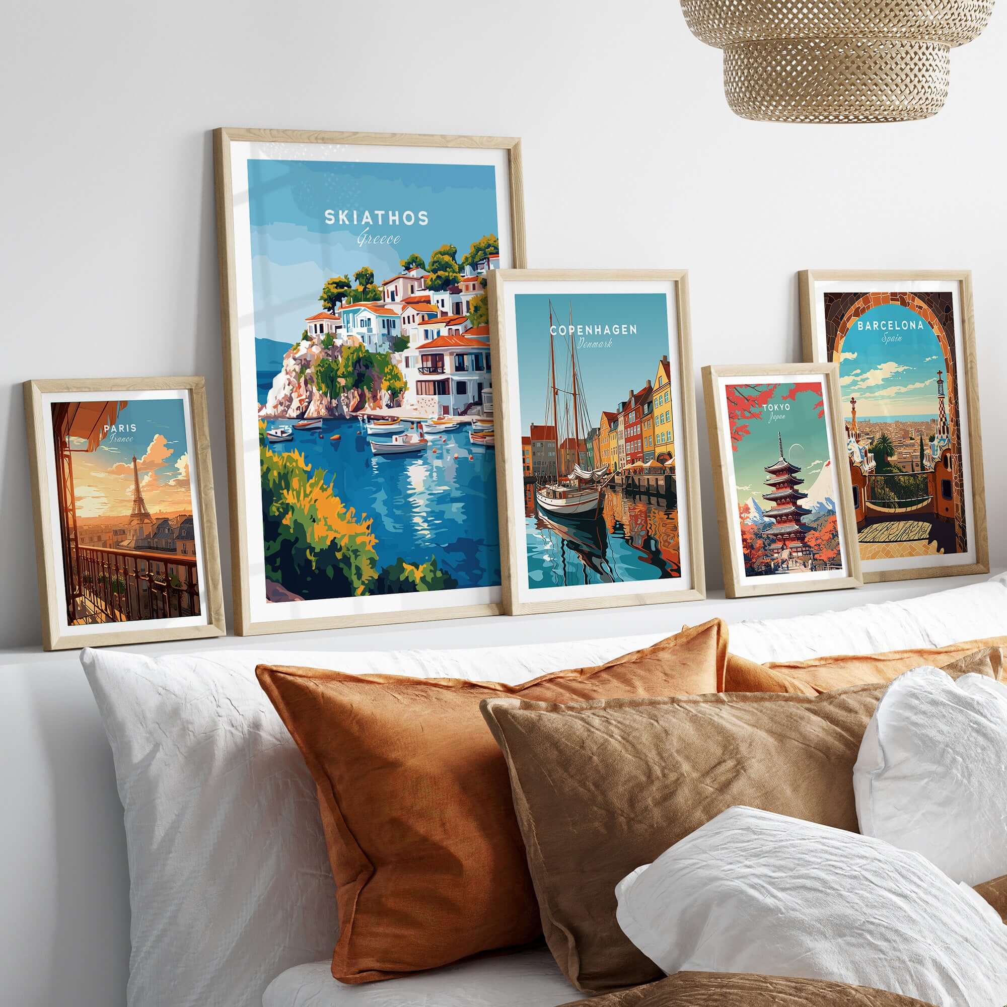 Skiathos Beach Escape: Stunning Greece Poster displayed among other travel posters on a cozy sofa.