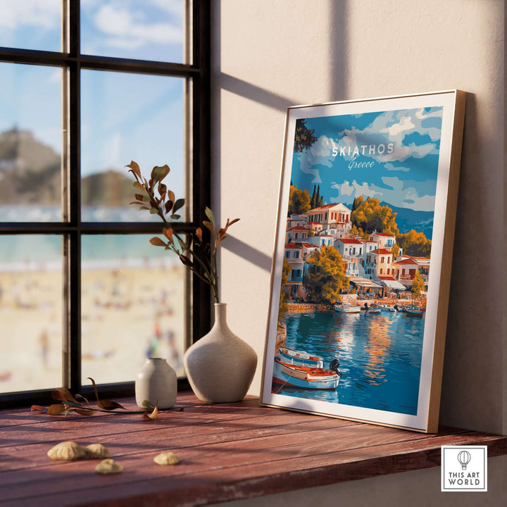 Skiathos Dreams art print displayed in a stylish interior by a sunny window, capturing Greece's beauty and charm.