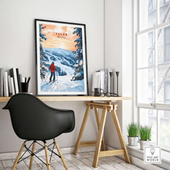 Skiing Ylläs Norway poster framed above a stylish desk, showcasing a serene winter landscape and a skier.