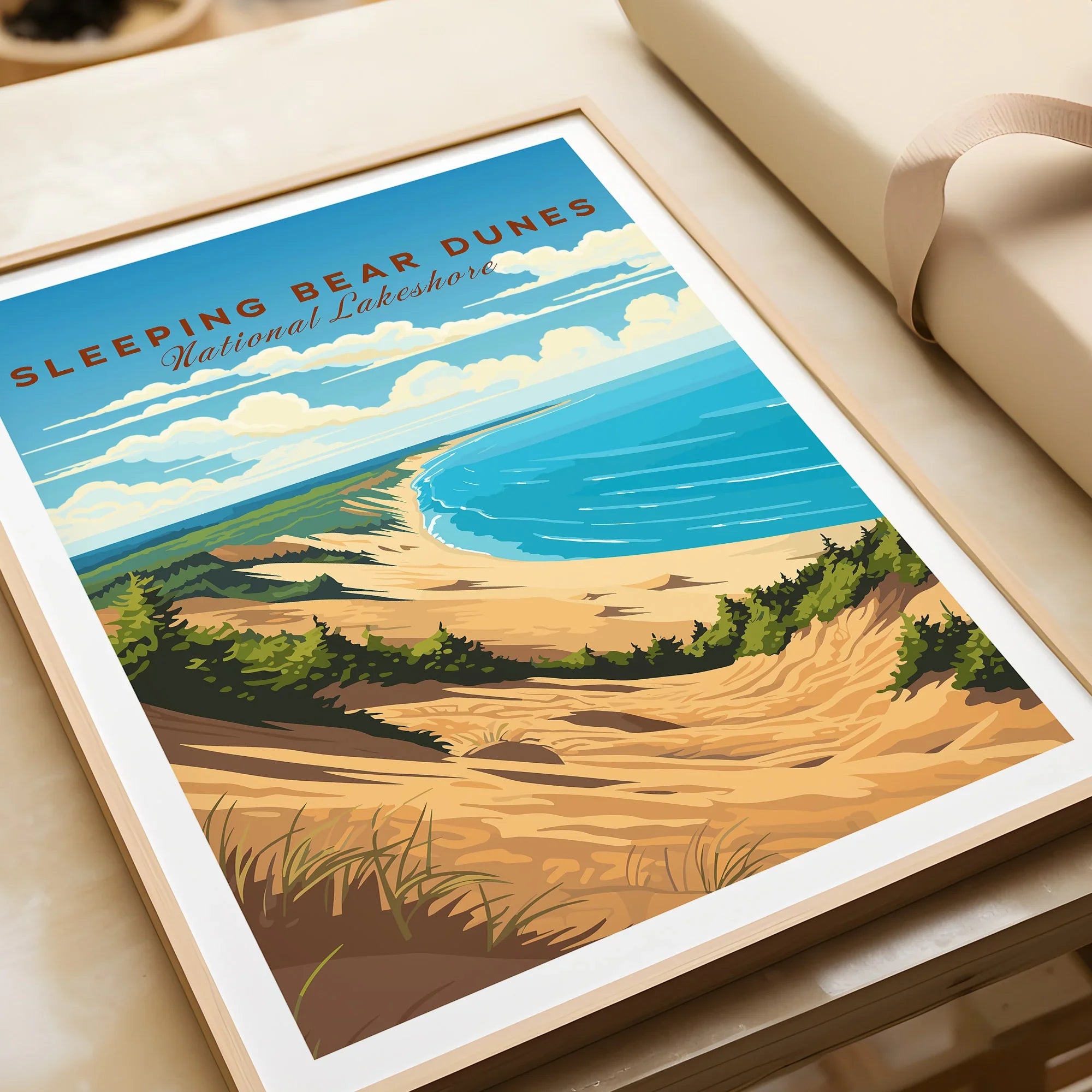 Sleeping Bear Dunes National Lakeshore art print with sandy dunes, blue lake, and green trees in a natural wood frame, closeup view