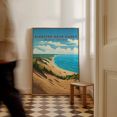 Framed Sleeping Bear Dunes National Lakeshore travel poster on floor in bright hallway
