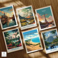Set of six framed travel and national park art prints on wooden floor, featuring Venice, Paris, The Highlands, Singapore, Sleeping Bear Dunes, and Sri Lanka.