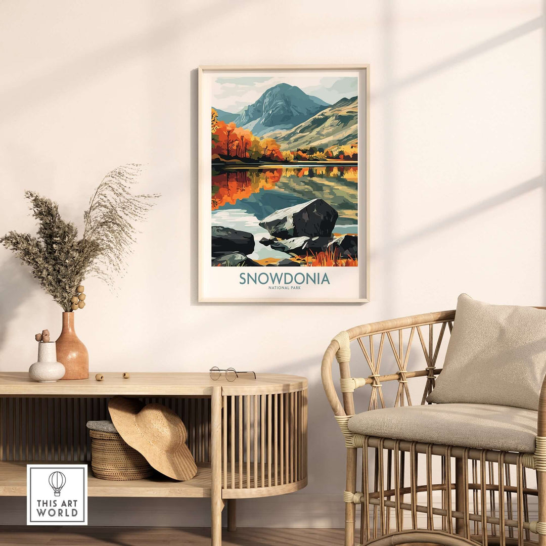 Snowdonia National Park poster displayed in a cozy living room setting with warm autumn colors and a stylish chair.