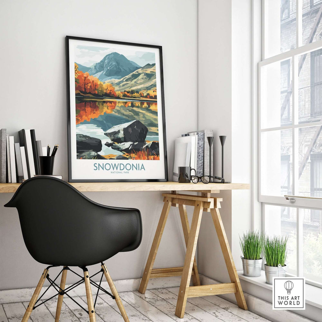 Snowdonia National Park poster displayed in a modern workspace with a stylish chair and plants, showcasing vibrant landscapes.